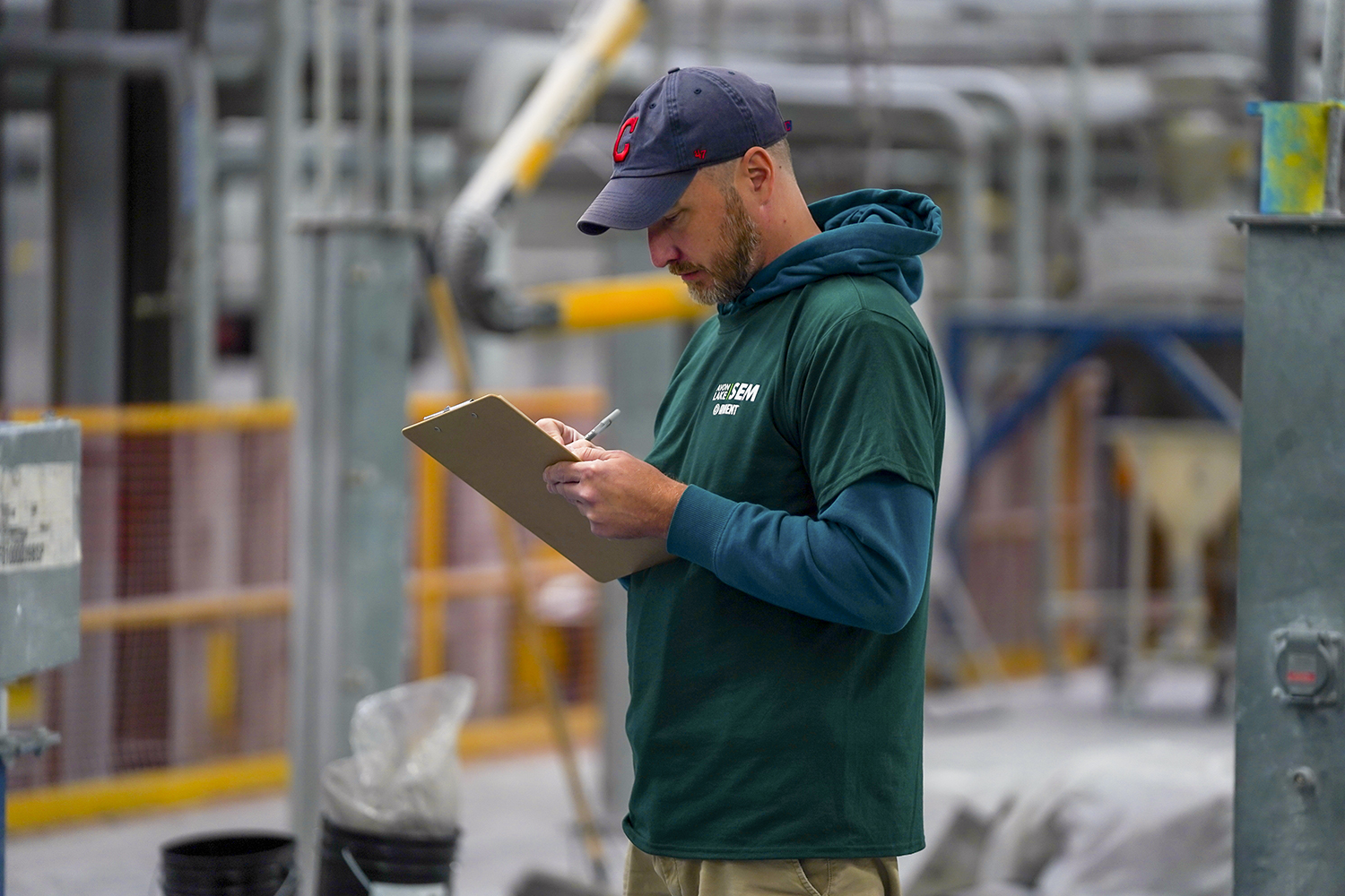 Man in warehouse with clipboard