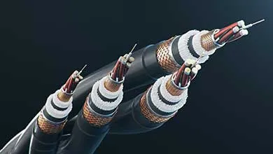Cross-section of four thick electrical cables on a dark background, showing central conductors, white insulation, braided metal shielding, and a black outer jacket.