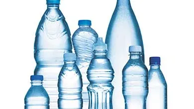 Variety of clear water bottles of different sizes on a white background
